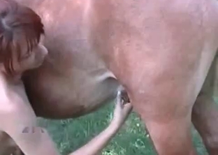 Redhead stimulates her lovely mare
