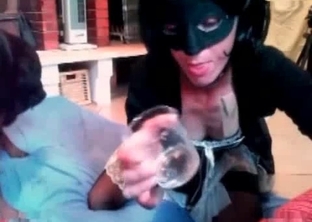 Woman wears a mask and loves animal jizz